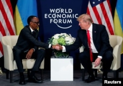 FILE - U.S. President Donald Trump meets President Paul Kagame of Rwanda during the World Economic Forum annual meeting in Davos, Switzerland, Jan. 26, 2018.