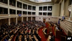 Greek lawmakers attend the third round of voting to elect a new president at the Parliament in Athens, Dec. 29, 2014.