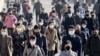 朝鲜首都平壤的人们佩戴口罩预防新冠病毒感染（共同社 /路透社 2020年3月30日）