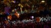 People cheer and wave esteledas, or Catalonia independence flags, during the "Yes" vote closing campaign in Barcelona, Spain, Sept. 29, 2017.