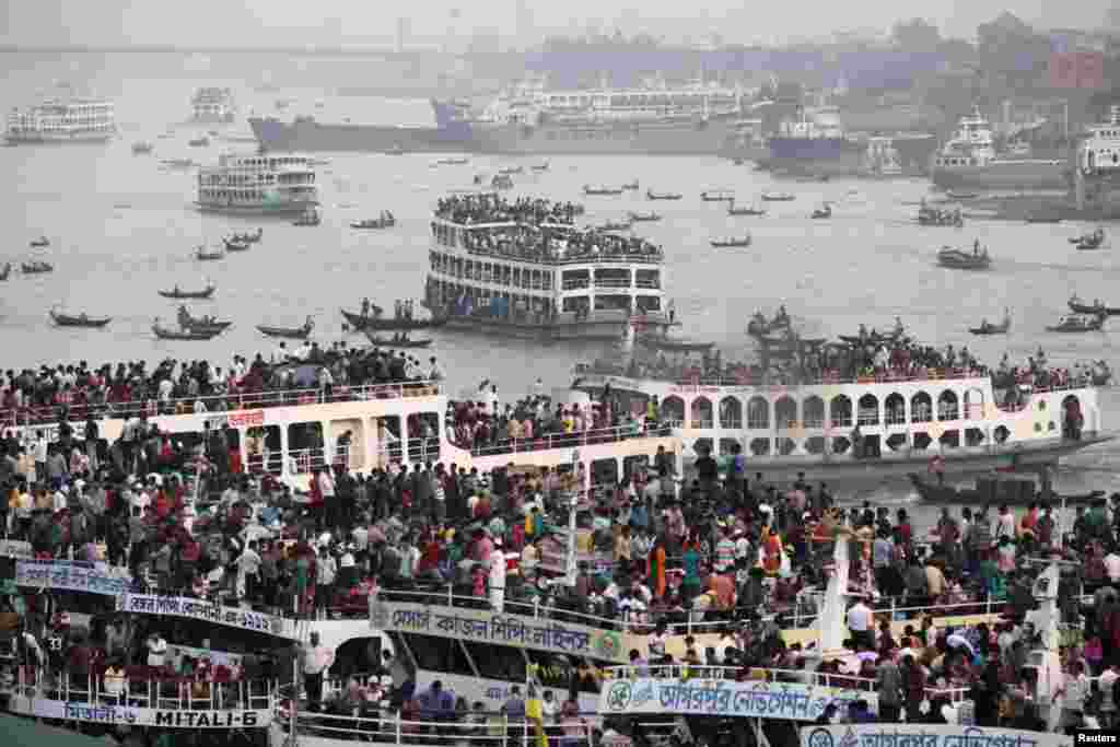 Overcrowded passenger boats are seen on the Buriganga River in Dhaka, Bangladesh. Millions of residents in Dhaka are travelling home from the capital city to celebrate Eid al-Adha on October 27, 2012.