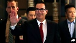 EE.UU. y China acordaron abandonar sus amenazas arancelarias, mientras trabajan en un acuerdo comercial más amplio, dijo el domingo el secretario del Tesoro estadounidense Steven Mnuchin.