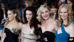From left to right, U.S. stars Sarah Jessica Parker, Kristin Davis, Kim Cattrall, and Cynthia Nixon pose for the photographers as they arrive for the British premiere of their film 'Sex and the City 2', at a central London cinema, on Thursday, May 27, 2010. (AP Photo/Lefteris Pit