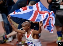 FILE - Britain's Mo Farah celebrates winning gold in the men's 10,000-meter final at Olympic Stadium at the 2012 Summer Olympics, London, Aug. 4, 2012. Farah moved to Britain as a child from his native Somalia.