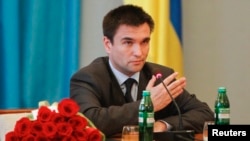 FILE - Ukraine's Foreign Minister Pavlo Klimkin is seen gesturing following his appointment at the Ministry of Foreign Affairs in Kyiv, June 19, 2014.