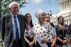 Democratic presidential candidate, Sen. Bernie Sanders, I-Vt., left, and Rep. Ilhan Omar, D-Minn., the sponsors of legislation to cancel all student loan debt, hold a news conference at the Capitol in Washington, Monday, June 24, 2019.