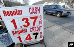 FILE - U.S. oil prices crashed below $27 dollars a barrel on Wednesday for the first time since 2003, caught in a broad slump across world financial markets. Gas is $1.39 per gallon in North Plainfield, N.J., Jan. 20, 2016.