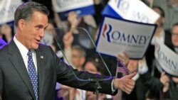 Mitt Romney greets supporters at his primary night rally in Manchester, New Hampshire