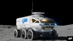 This graphic illustration provided by Toyota Motor Corp. shows a vehicle called "Lunar Cruiser" to explore the lunar surface. (Toyota Motor Corp. via AP)