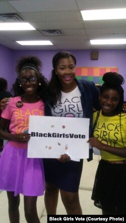 Nykidra “Nyki” Robinson (center) with two girls at a Black Girls Vote event.