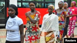 Girls who escaped from their Boko Haram captors arrive at the presidential villa in Abuja, July 22, 2014. 