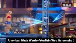 Jessie Graff competes in a Wonder Woman costume on the 'American Ninja Warrior' television program.