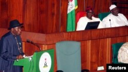 FILE - Nigeria's President Goodluck Jonathan (L) presents the 2013 budget proposal as Senate President David Mark (C) and House speaker Aminu Tambuwal look on at a joint sitting of the parliament in the capital Abuja, October 2012.