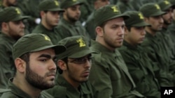 Milicianos de Hezbolá celebran el día del mártir en Beirut, Líbano.