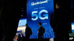 A sign advertises 5G at the Qualcomm booth at CES International, Wednesday, Jan. 9, 2019, in Las Vegas. (AP Photo/John Locher)