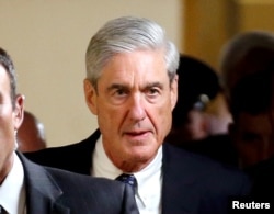 FILE - Special Counsel Robert Mueller departs after briefing members of the U.S. Senate on his investigation into potential collusion between Russia and the Trump campaign on Capitol Hill in Washington.