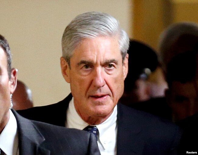 FILE - Special Counsel Robert Mueller departs after briefing members of the U.S. Senate on his investigation into potential collusion between Russia and the Trump campaign on Capitol Hill in Washington.