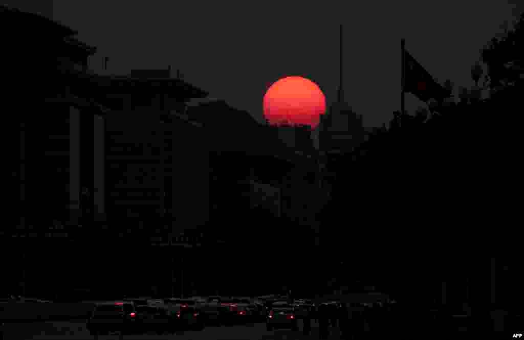 The sun sets behind Tiananmen Gate in Beijing ahead of the 70th anniversary of the founding of the People&#39;s Republic of China.