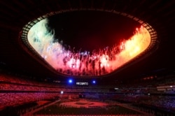 Tokyo 2020 Olympics - The Tokyo 2020 Olympics Closing Ceremony - Olympic Stadium, Tokyo, Japan - August 8, 2021. Fireworks explode as a sign that says "Thank You" is displayed at the end of the closing ceremony