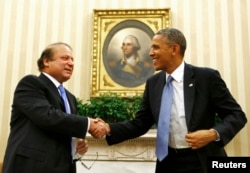 FILE - U.S. President Barack Obama shakes hands with Pakistan's Prime Minister Nawaz Sharif in the Oval Office at the White House in Washington, Oct. 23, 2013.