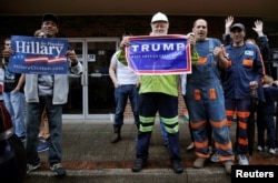 FILE - Supporters of U.S. Democratic presidential candidate Hillary Clinton and Republican presidential Donald Trump cheer outside a campaign event in Williamson, West Virginia,May 2, 2016.