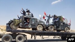 A handout picture released by the Iraqi Federal Police on Aug. 15, 2017, shows Iraqi armored units headed for the town of Tal Afar, the main remaining Islamic State stronghold in the northern part of the country. Iraqi warplanes carried out airstrikes against IS group positions in Tal Afar in preparation for a ground assault.