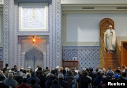 Members of the Muslim community attend the Friday prayer at Strasbourg Grand Mosque, one week after the deadly attacks in Paris, France, Nov. 20, 2015.
