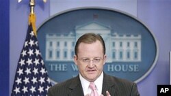 White House Press Secretary Robert Gibbs gestures during his daily news briefing at the White House in Washington, Nov., 30, 2010