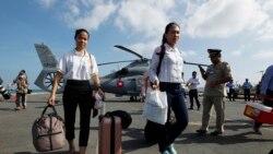 Cambodian medical officers arrive for health checks on passengers and crew of the cruise ship Westerdam in Sihanoukville, Cambodia, Thursday, Feb. 13, 2020.