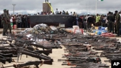 Police display weapons collected from Niger delta militants as part of a government amnesty program, Yenagoa, August 2009.