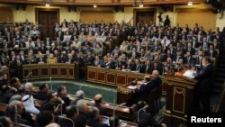 Egyptian President Mohamed Mursi delivers a speech to the Shura Council, or upper house of parliament, in Cairo, December 29, 2012. 