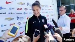 U.S. midfielder Carli Lloyd speaks to reporters before a training session for the round of eight in the FIFA 2015 women's World Cup soccer tournament at Algonquin College in Ottawa, Ontario, June 24, 2015.