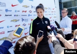 U.S. midfielder Carli Lloyd speaks to reporters before a training session for the round of eight in the FIFA 2015 women's World Cup soccer tournament at Algonquin College in Ottawa, Ontario, June 24, 2015.