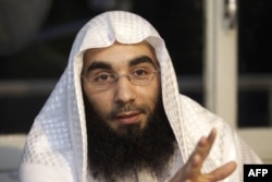File - 'Sharia4Belgium' spokesman Fouad Belkacem speaks during a press conference in Sint-Jans-Molenbeek in Brussels, on June 1, 2012.