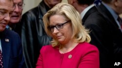 FILE - Rep. Liz Cheney, R-Wyo, waits for President Donald Trump to arrive to sign various bills in the Roosevelt Room of the White House, March 27, 2017, in Washington.