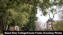 Students sit outside at Sweet Briar College, which came very close to closing in 2015.