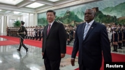 China's President Xi Jinping and President of Botswana Mokgweetsi Masisi review the Chinese People's Liberation Army honor guard during the welcome ceremony at the Great Hall of the People in Beijing, Aug. 31, 2018.