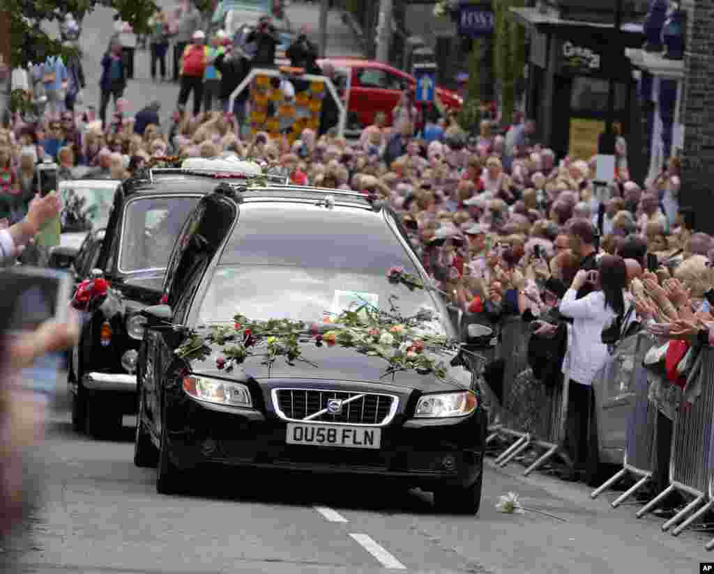 The funeral cortege of British singer and TV personality Cilla Black makes its way to St. Mary's Church in Liverpool, England. Cilla Black, 72, died in Spain on Aug. 1, 2015.