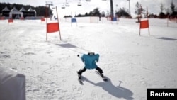 Robot TaekwonV, the winning robot, takes part in a practice run at the Ski Robot Challenge at the Welli Hilli ski resort in Hoenseong, South Korea, February 12, 2018. REUTERS/Kim Hong-Ji