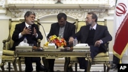 Iran's parliament speaker Ali Larijani (r) meets with Brazil's Foreign Minister Celso Amorim (l) in Tehran, 26 Apr 2010