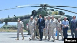 Syria's President Bashar al-Assad visits a Russian air base at Hmeymim, in western Syria in this handout picture posted on SANA, June 27, 2017.