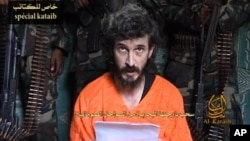 In this undated image from a video posted on Islamic militant websites and made available on June 9, 2010, a man identified as French security agent Denis Allex pleads for his release from the Somali militant group al-Shabab.
