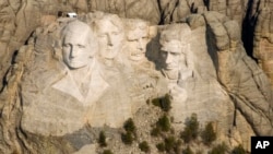 FILE - Mount Rushmore National Memorial in the Black Hills of South Dakota. Millions of workers and school children in the United States have the day off Monday for the annual Presidents' Day holiday.