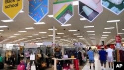 FILE - In this July 31, 2018 photo, shoppers walk into a store in Methuen, Mass. The US Commerce Department says retail sales increased 0.5 percent last month.