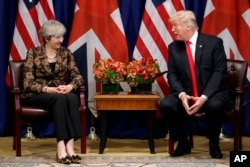 FILE - President Donald Trump meets with British Prime Minister Theresa May at the Palace Hotel during the United Nations General Assembly, Sept. 20, 2017, in New York.