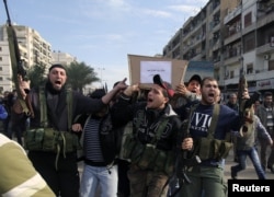 Lebanese Islamist gunmen fire their weapons as three bodies of other members of their group arrive from Syria, in Tripoli in northern Lebanon, December 9, 2012.