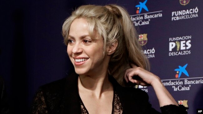 FILE - Pop singer Shakira smiles before a press conference for a charity event at Camp Nou stadium in Barcelona, Spain, March 28, 2017.