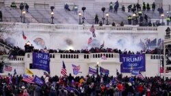 In this Wednesday, Jan. 6, 2021, file photo, violent protesters, loyal to President Donald Trump, storm the Capitol, in Washington. (AP Photo/John Minchillo, File)