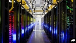 In this undated file photo made available by Google shows the campus-network room at a data center in Council Bluffs, Iowa. 