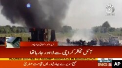 In this image taken from video, black smoke rises from oil tanker on road in Bahawalpur, Pakistan, June 25, 2017.